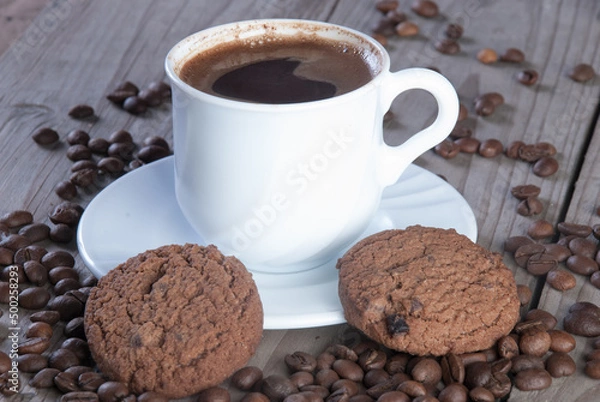 Fototapeta Fresh coffee with biscuits and roasted beans