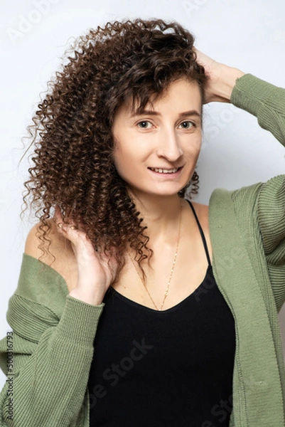 Obraz Young beautiful girl with clean skin and curls smiles
