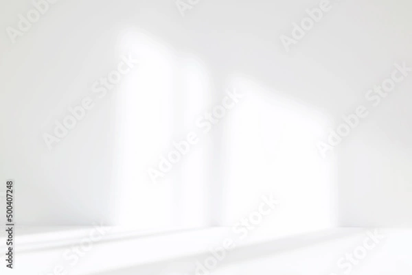 Fototapeta Abstract white studio background for product presentation. Empty room with shadows of window. Display product with blurred backdrop.