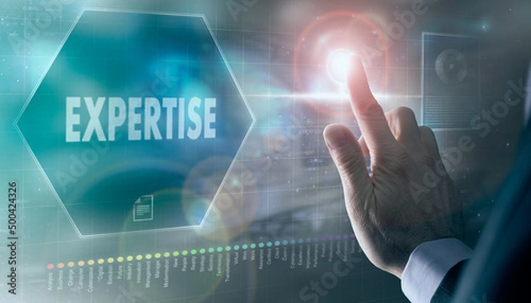 Fototapeta A businessman controlling a futuristic display with a Expertise business concept on it.