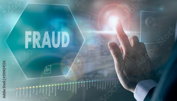 Fototapeta A businessman controlling a futuristic display with a Fraud business concept on it.