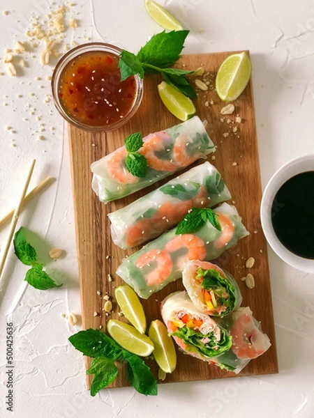 Obraz Spring roll with seafood and vegetables in rice paper.
