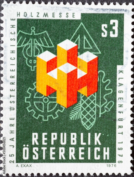 Fototapeta Austria - circa 1976 : a postage stamp from Austria, showing a graphic for the Austrian Wood Fair, Klagenfurt. 25 years