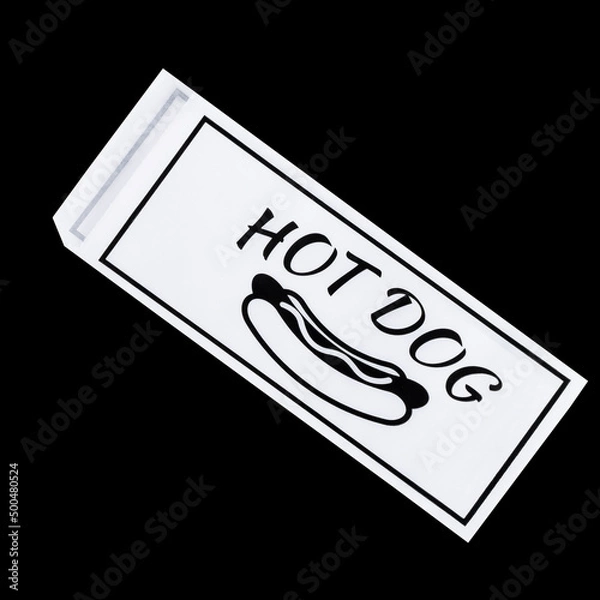 Fototapeta white paper bag for a hot dog on a black background