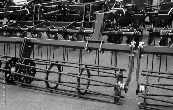 Fototapeta Parts and components of agricultural machines. Plough. Harrow. Cultivator. Fragment.