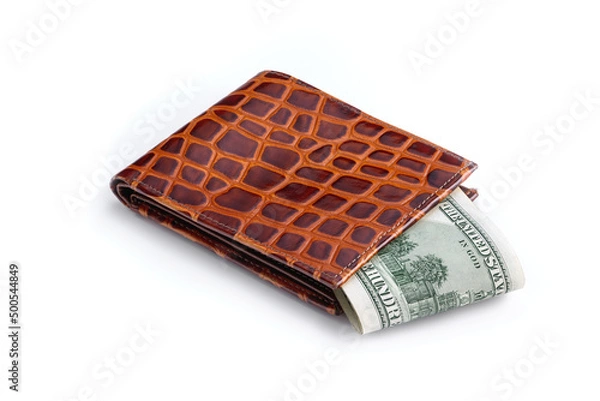 Fototapeta Lots of american hundred dollar bills in a leather wallet. Has a clipping path saved.