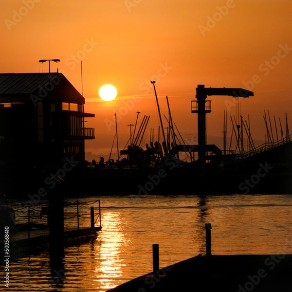 Obraz golden sunrise on the pier over the sea