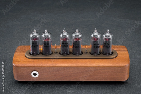 Fototapeta clock with discharge lamps in a wooden case