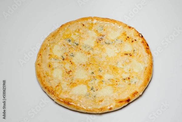 Fototapeta delicious hot pizza with chicken, mozzarella and tomatoes on a white background top view