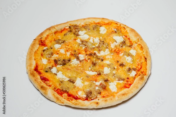 Fototapeta delicious hot pizza with chicken, mozzarella and tomatoes on a white background top view