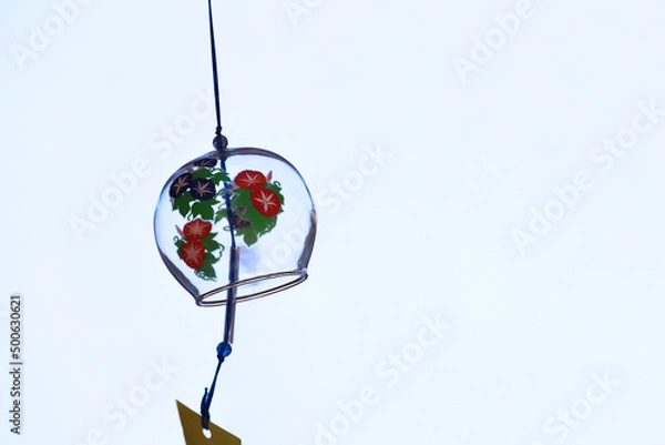 Obraz The eaves of a shop where a wind chime called "Furin", a Japanese summer tradition, is hung.