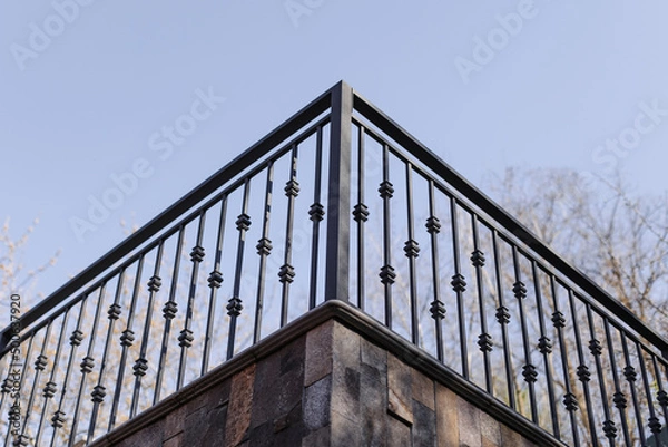 Fototapeta Modern metal railings and handrails in the loft style. The metal is treated with a primer and anti-corrosion paint. Interior design in industrial style.