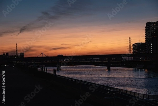 Obraz 陽が落ちていく空と川