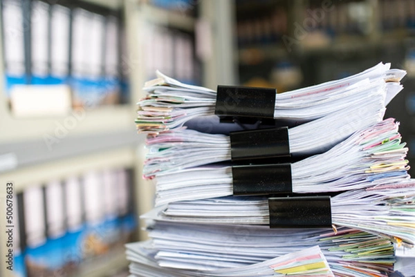 Fototapeta documents achieves paper files for searching information on work desk home office