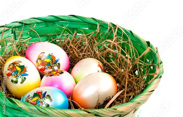 Fototapeta Easter eggs in a nest on a white background