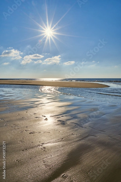 Obraz Nordseestrand mit Sonnenstern im Hochformat