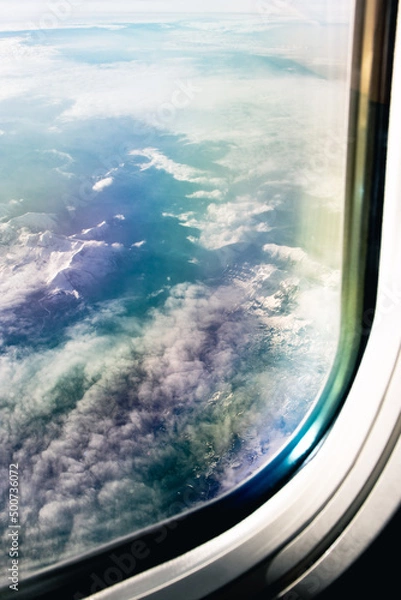 Fototapeta View form the airplane window on the clouds