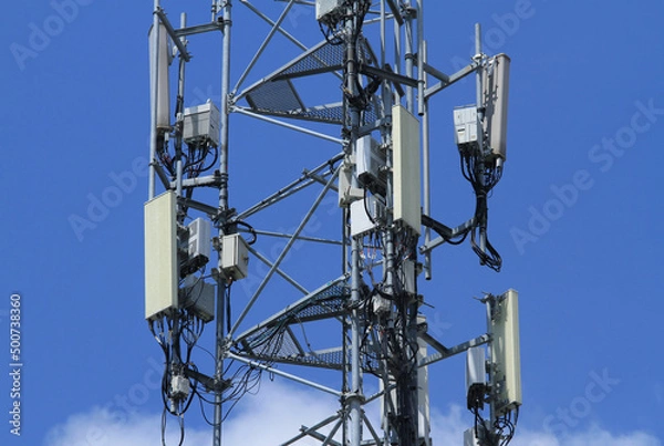 Fototapeta Telecommunication tower 4G 5G antenna on blue sky