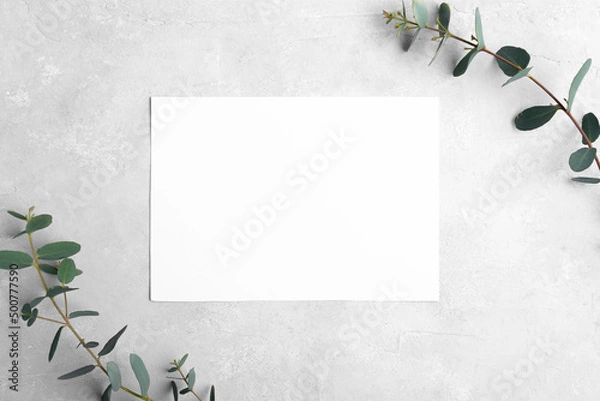 Obraz Wedding stationery invitation card mockup 7x5 on neutral grey stone background with eucalyptus leaves, natural lighting, bridal shower mockup Minimal blank card mockup, thank you card, greeting card