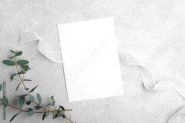Obraz Wedding stationery invitation card mockup 5x7 on neutral grey stone background with eucalyptus leaves, natural lighting, bridal shower mockup Minimal blank card mockup, thank you card, greeting card