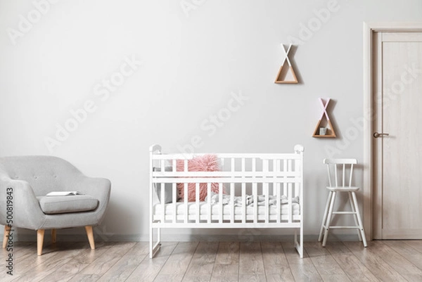 Fototapeta Interior of modern children's room with comfortable crib