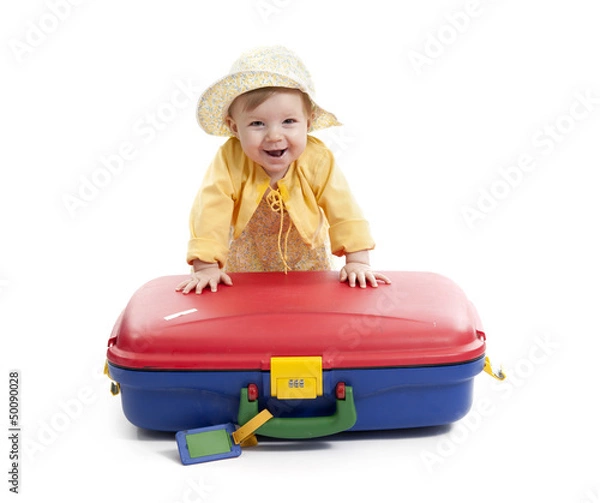 Obraz laughing baby with red and blue suitcase, on white