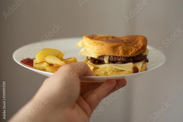Fototapeta Handmade hamburger with french fries and dips made at home