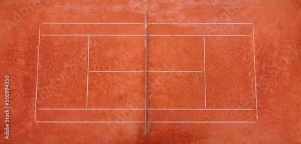 Fototapeta Aerial view of clay tennis courts located in a green park and used for exercise and preparation of athletes and recreationists