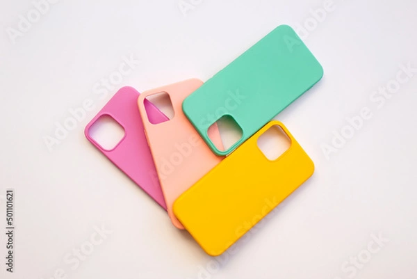 Fototapeta Cases set for smartphone on white background. Silicone protection for mobile phone. Colorful silicone phone cases.