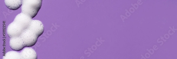 Obraz Foam swatch on a purple background. Soapy liquid texture with bubbles.