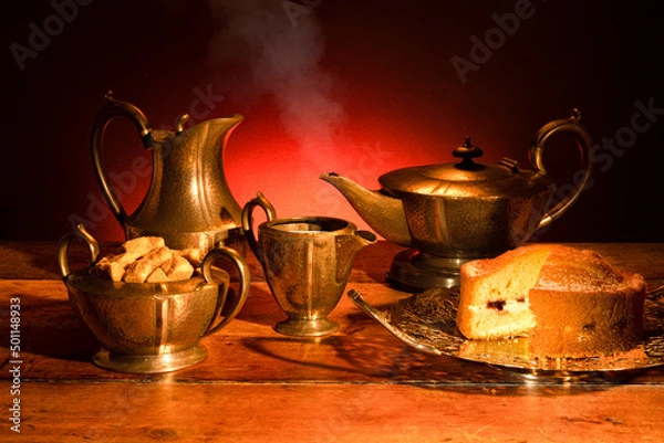 Obraz A vintage pewter tea set, with delicious cake served on a vintage cake plate.  