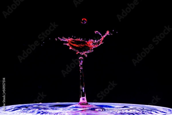 Obraz As red water dropped into blue water, the splash made a beautiful cocktail, complete with cherry.