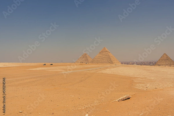 Fototapeta The Great Pyramid of Giza is a defining symbol of Egypt and the last of the ancient Seven Wonders of the World. The massive temple complex of Karnak was the principal religious center of the god Amun.