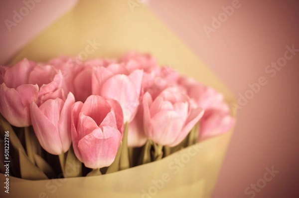 Obraz Tulips flowers bouquet with pink tulips in green paper