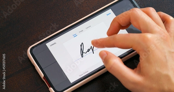 Fototapeta Electonic signature with finger in phone screen