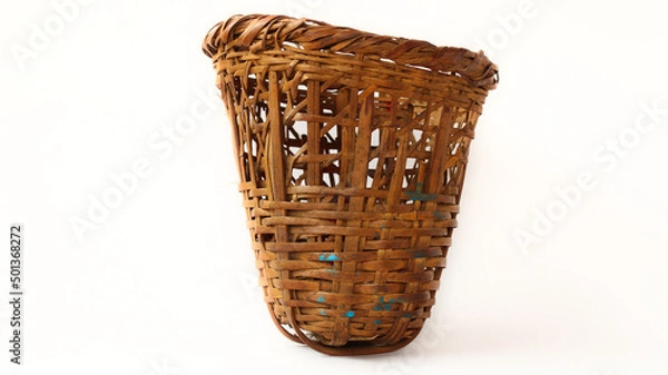 Fototapeta Traditional small basket (doko) in Nepali language  used for carrying items. Made of bamboo. White Background or isolated Background