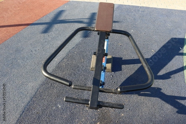 Fototapeta trainers and horizontal bars in city yard