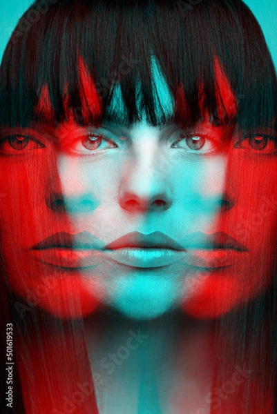 Obraz Woman with bob haircut long dark hair close-up fashion portrait in RGB color split. RGB effect make reflection of model face in red and blue colors. Abstract and futuristic looking style
