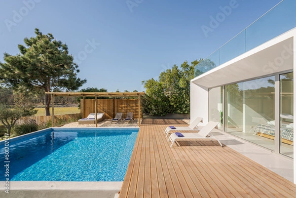 Obraz Modern villa with pool and deck with interior