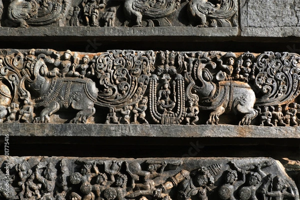 Fototapeta Sculptures on the outer walls of Hoysaleswara Temple at Halebidu, the former capital of the Hoysala, Karnataka.
