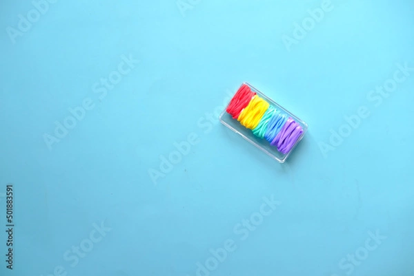 Fototapeta rainbow color Rubber bands on color background 