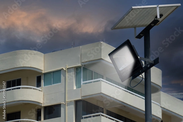 Obraz Close up street or garden lamp post with solar cell panel energy (against blue sky background)