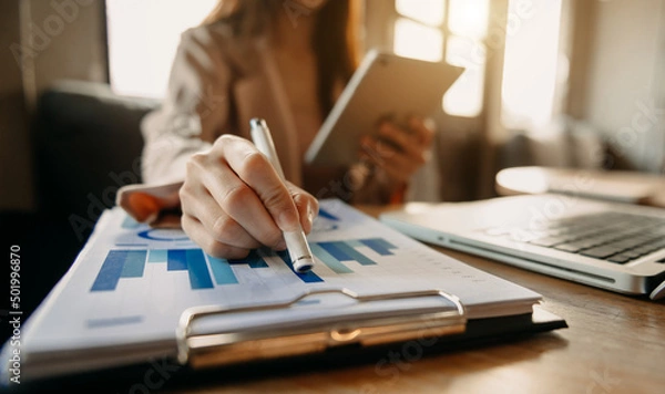 Fototapeta businessman using on smartphone and tablet as concept.