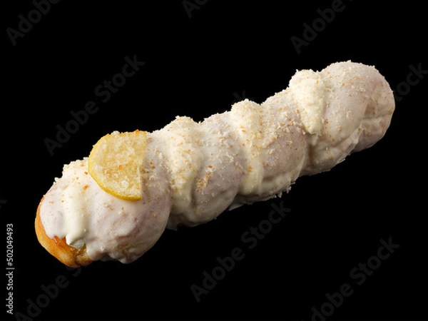 Fototapeta Donut-pigtail in white glaze on a black background