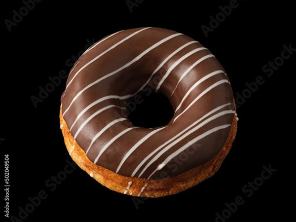 Fototapeta Biscuit donut with chocolate icing on a black background