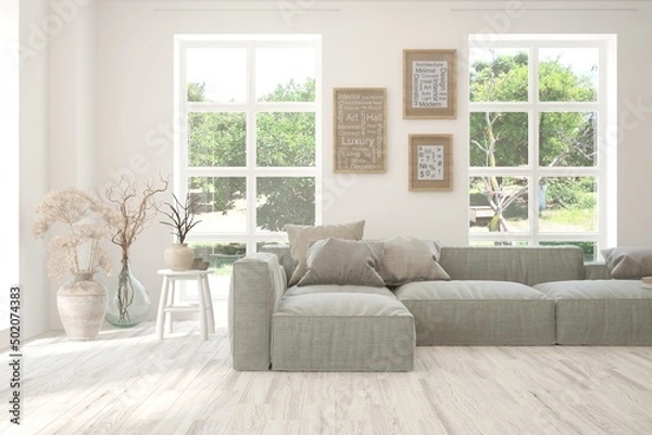 Fototapeta Minimalist living room in white color with sofa and summer landscape in window. Scandinavian interior design. 3D illustration