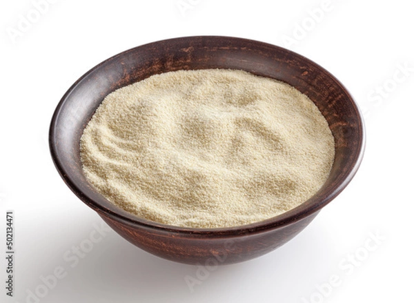 Obraz Semolina flour in ceremic bowl isolated on white background with clipping path