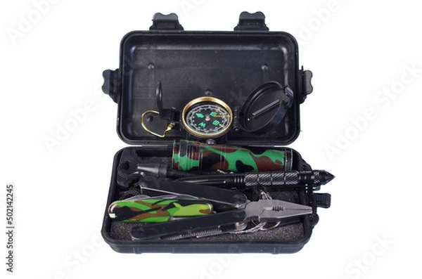 Obraz Container survival kit. Compass, pliers, knife, flint and steel, flashlight, tactical pen. Isolated on white.