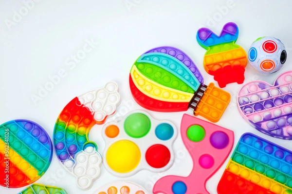 Obraz Rainbow bubble toys in different shapes to relieve stress.