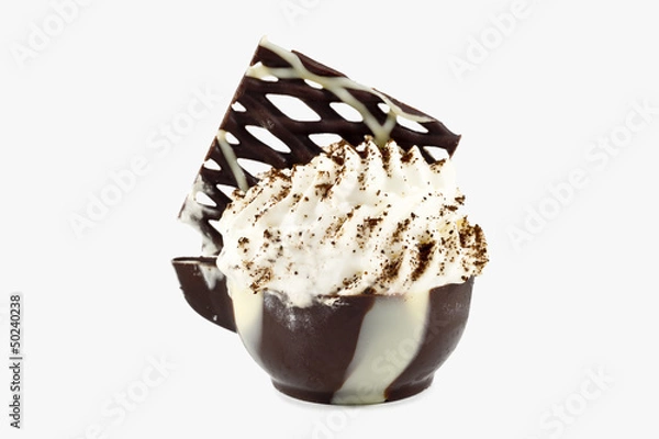 Fototapeta Whipped cream and white chocolate  in a  chocolate cup.